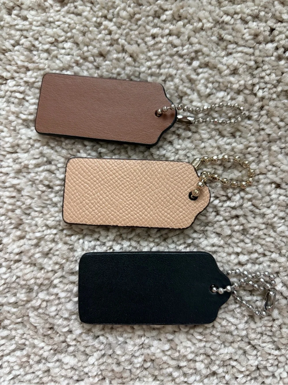 COACH Black and Beige Leather Tag Keychain Trio